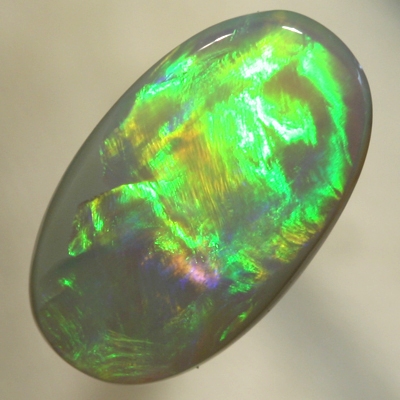 SOLID SEMI BLACK OPAL Very large rolling flashes showing a neon Flame pattern